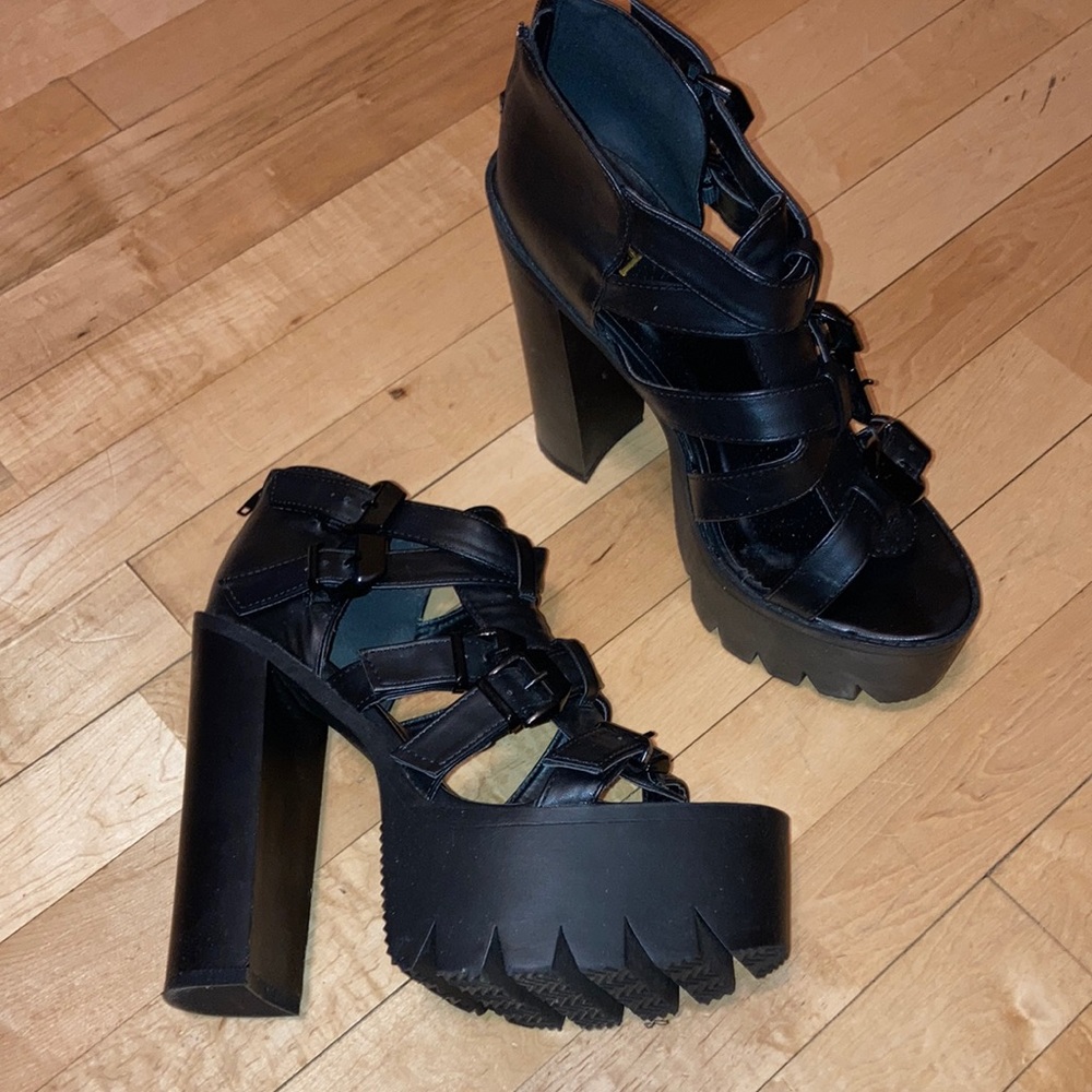 Black high heel platform strappy shoes with buckles